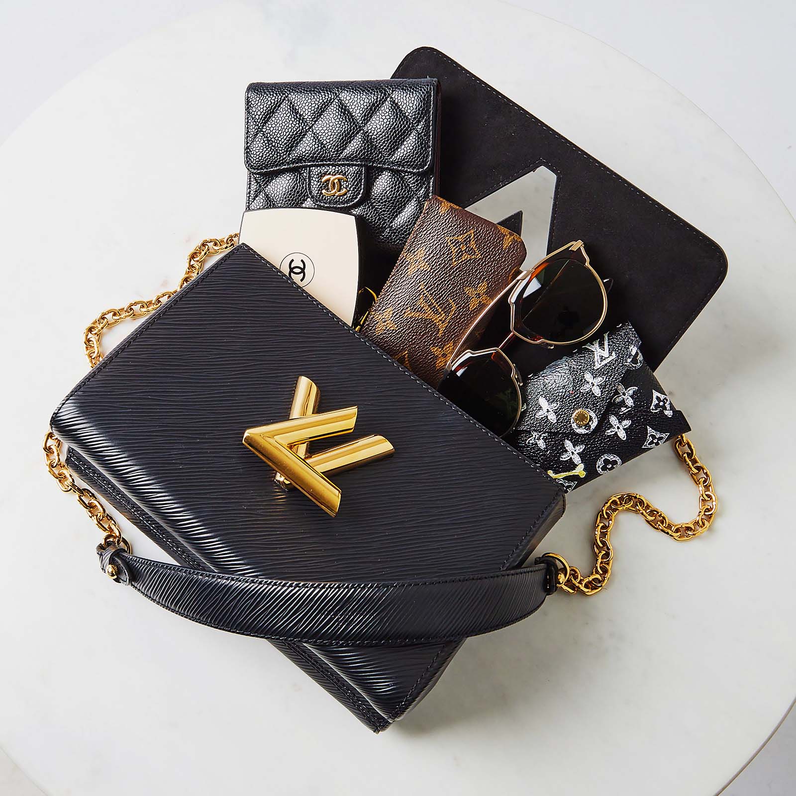 Louis Vuitton Epi Leather Twist Bag Open With Accessories Spilling Out Flatlay | by Yoogi's Closet Authenticated Pre-Owned Luxury yoogiscloset.com